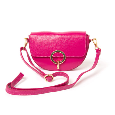 The fuchsia pink Oslo Leather Crossbody Handbag with a long adjustable strap for wearing across the body