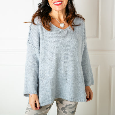 The blue Outer Seam Jumper with long sleeves and a v neckline 