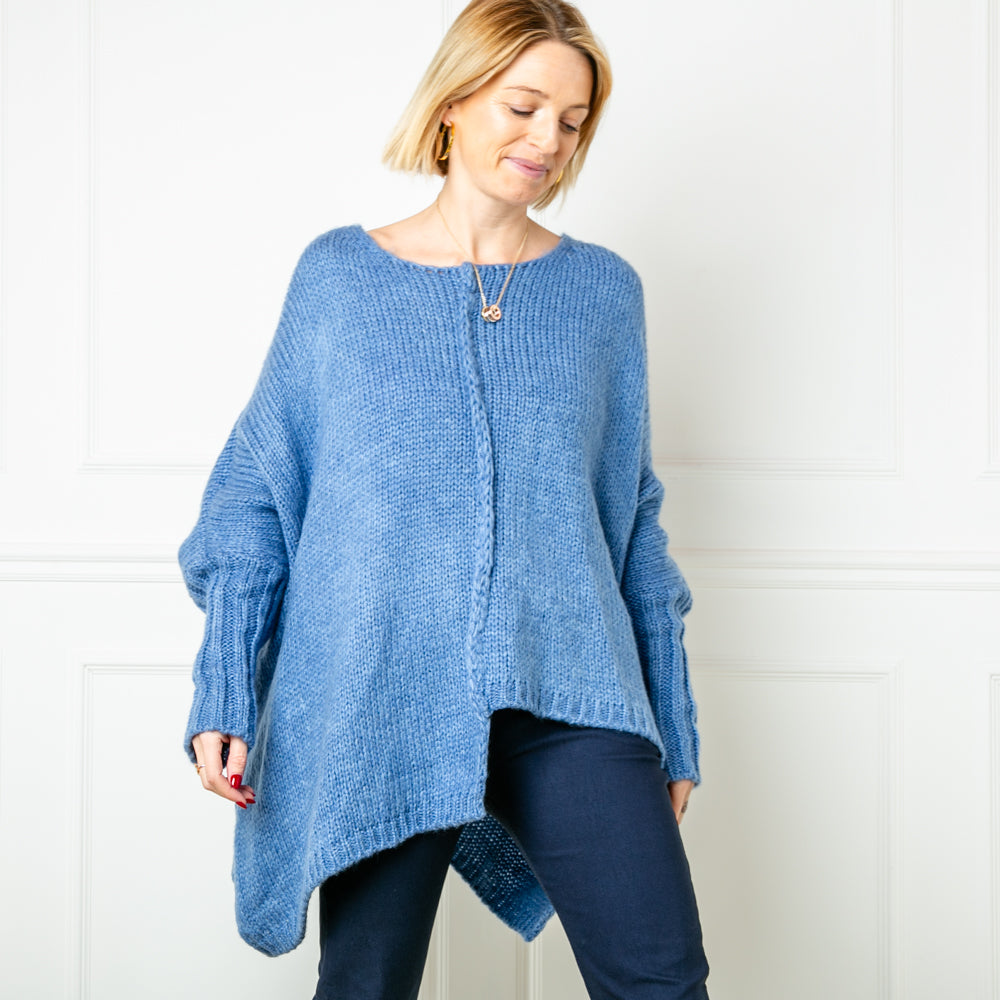 The denim oversized jumper from Tilley and Grace. The picture shows a high cuff with a cable stich down the front of the jumper to a wonky hem line. 