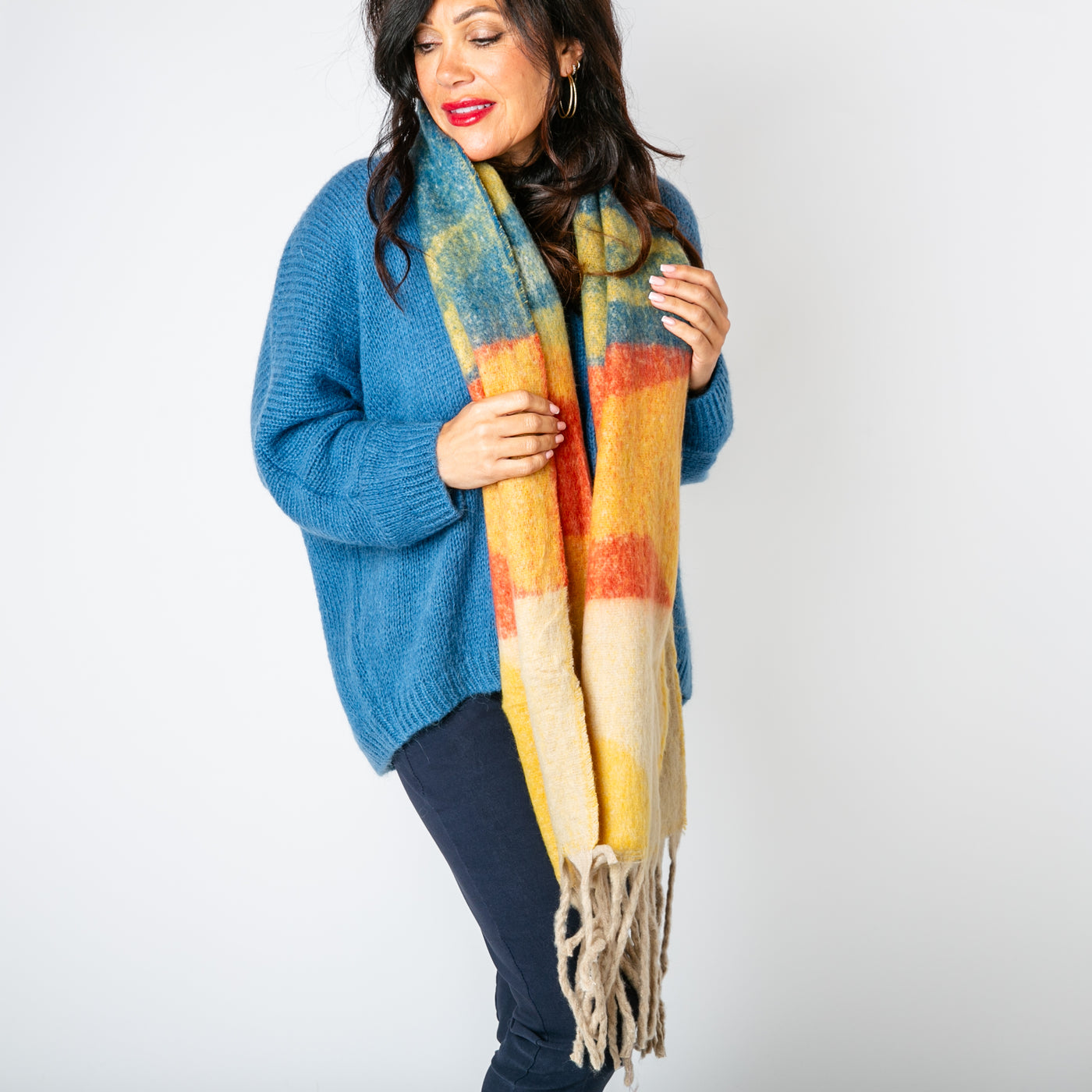 The Ozzy Multicolour Scarf in Burnt Pepper made from a super soft chunky knit with tassels at either end