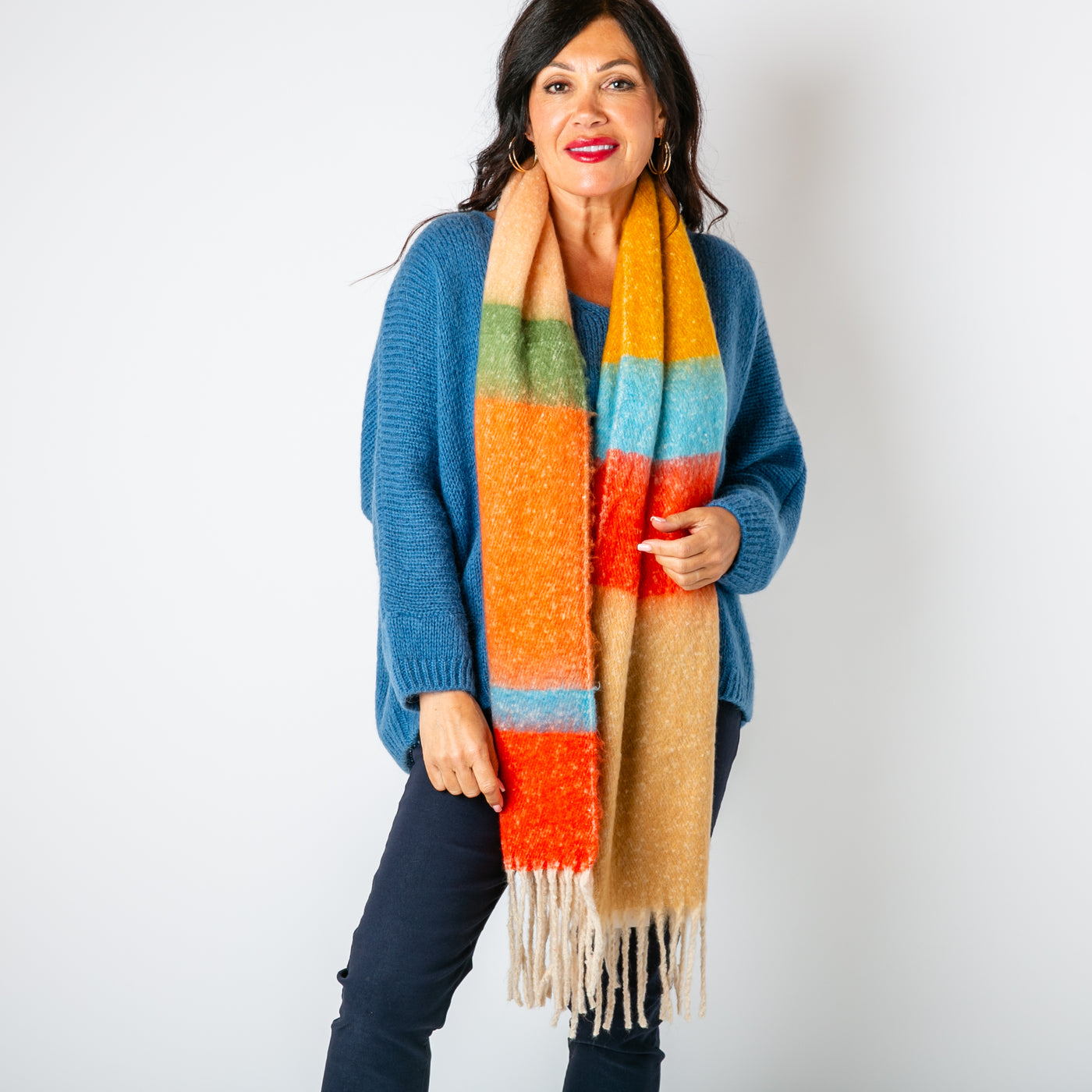 The Ozzy Multicolour Scarf in Russet Rose made from a super soft chunky knit with tassels at either end