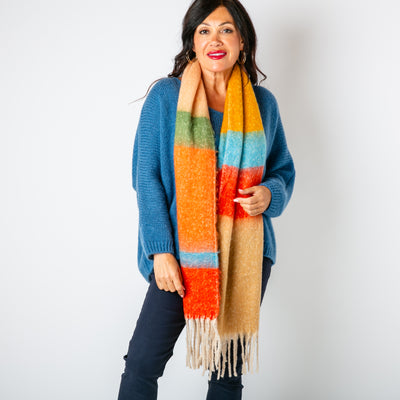 The Ozzy Multicolour Scarf in Russet Rose made from a super soft chunky knit with tassels at either end