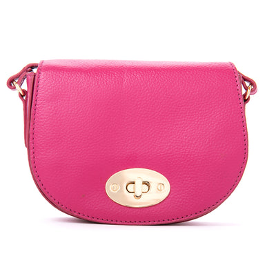 The Paris Leather Handbag in Raspberry Pink with gold hardware including a twisty metal clasp fastening