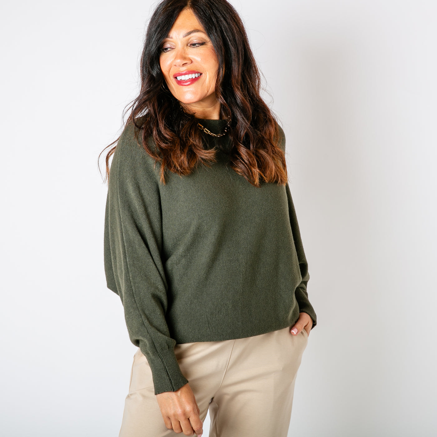 The khaki green Pearl Back Jumper with long sleeves with ribbed stretchy cuffs