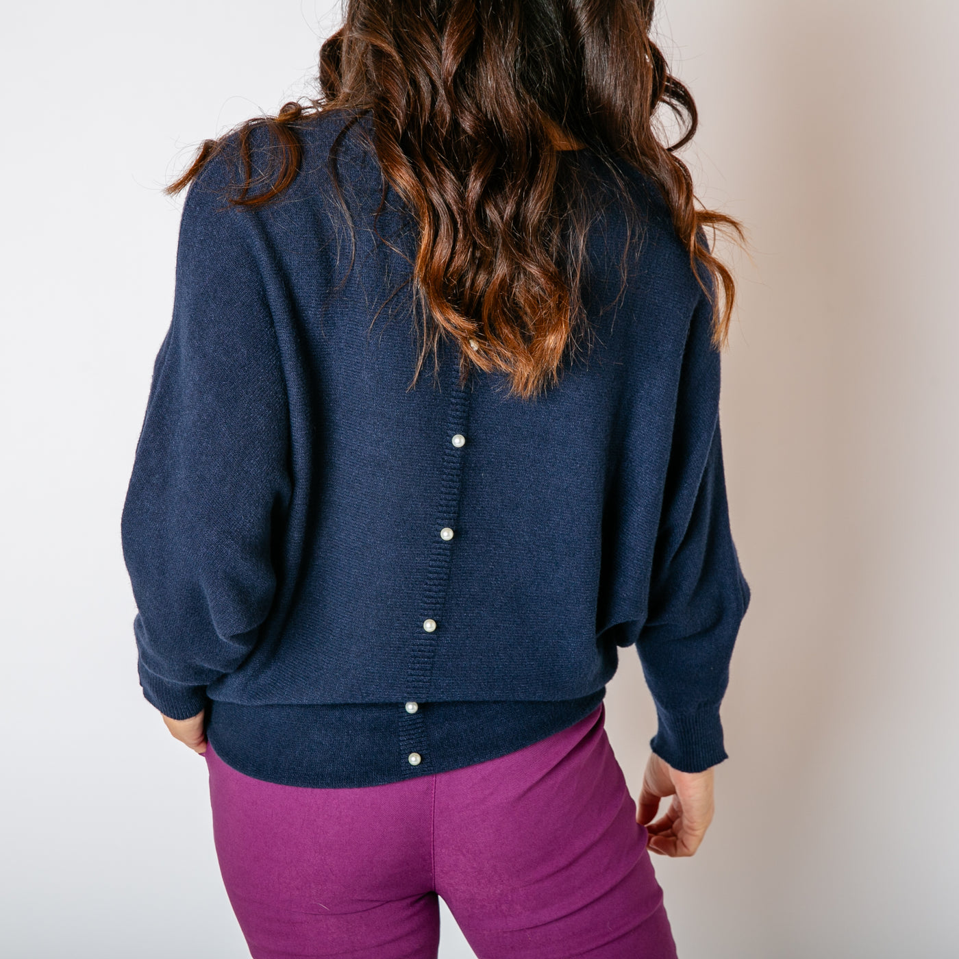 The navy blue Pearl Back Jumper relaxed batwing sleeves for a comfy fit