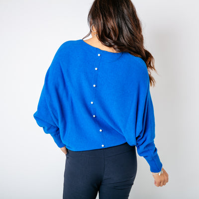 The royal blue Pearl Back Jumper with a beautiful pearl button detail running down the back of the jumper