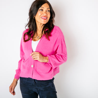 The fuchsia pink Pearl Button Cardigan made from a super soft, fine knitted blend