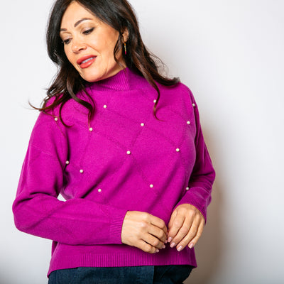 The berry purple Pearl Detail Mock Neck Jumper with a beautiful pearl pattern on the front