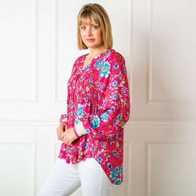The fuchsia pink Peony Jersey Cuff Top in a relaxed fit featuring a beautiful floral pattern, perfect for spring