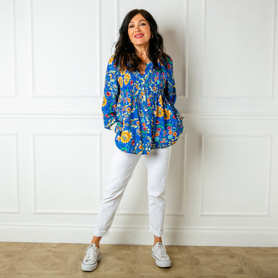 The royal blue Peony Jersey Cuff Top in a relaxed fit featuring a beautiful floral pattern, perfect for spring