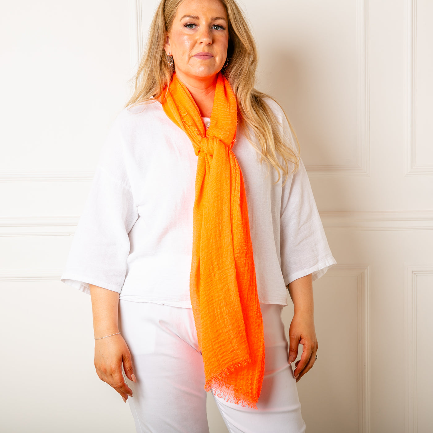 The coral orange Plain Summer Scarf made from a soft, lightweight viscose material