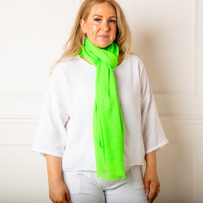 The Plain Summer Scarf in lime green which can be worn in lots of different ways