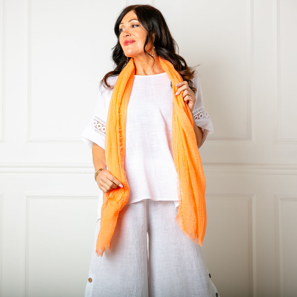 The orange Plain Summer Scarf made from a soft, lightweight viscose material