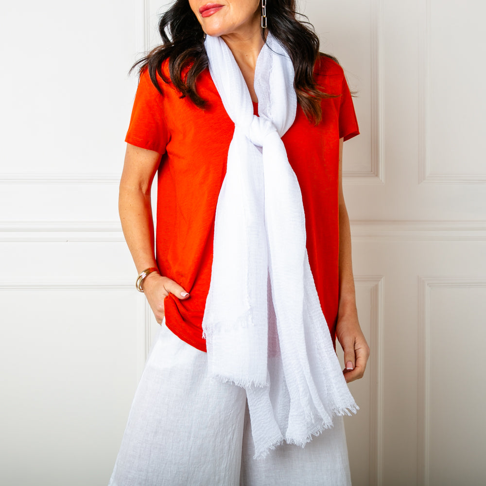 The Plain Summer Scarf in white which can be worn in lots of different ways 