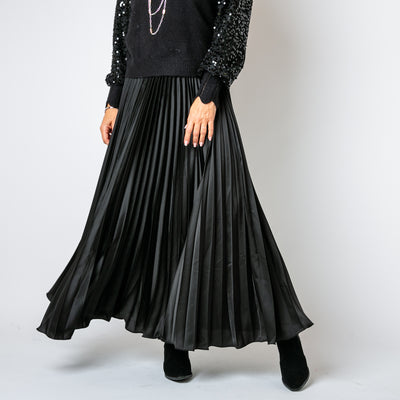 The Pleated Cocktail Skirt in black with elastic around the back of the waistband