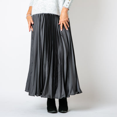 The Pleated Cocktail Skirt in charcoal grey with elastic around the back of the waistband