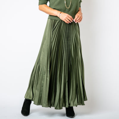 The Pleated Cocktail Skirt in olive green with elastic around the back of the waistband