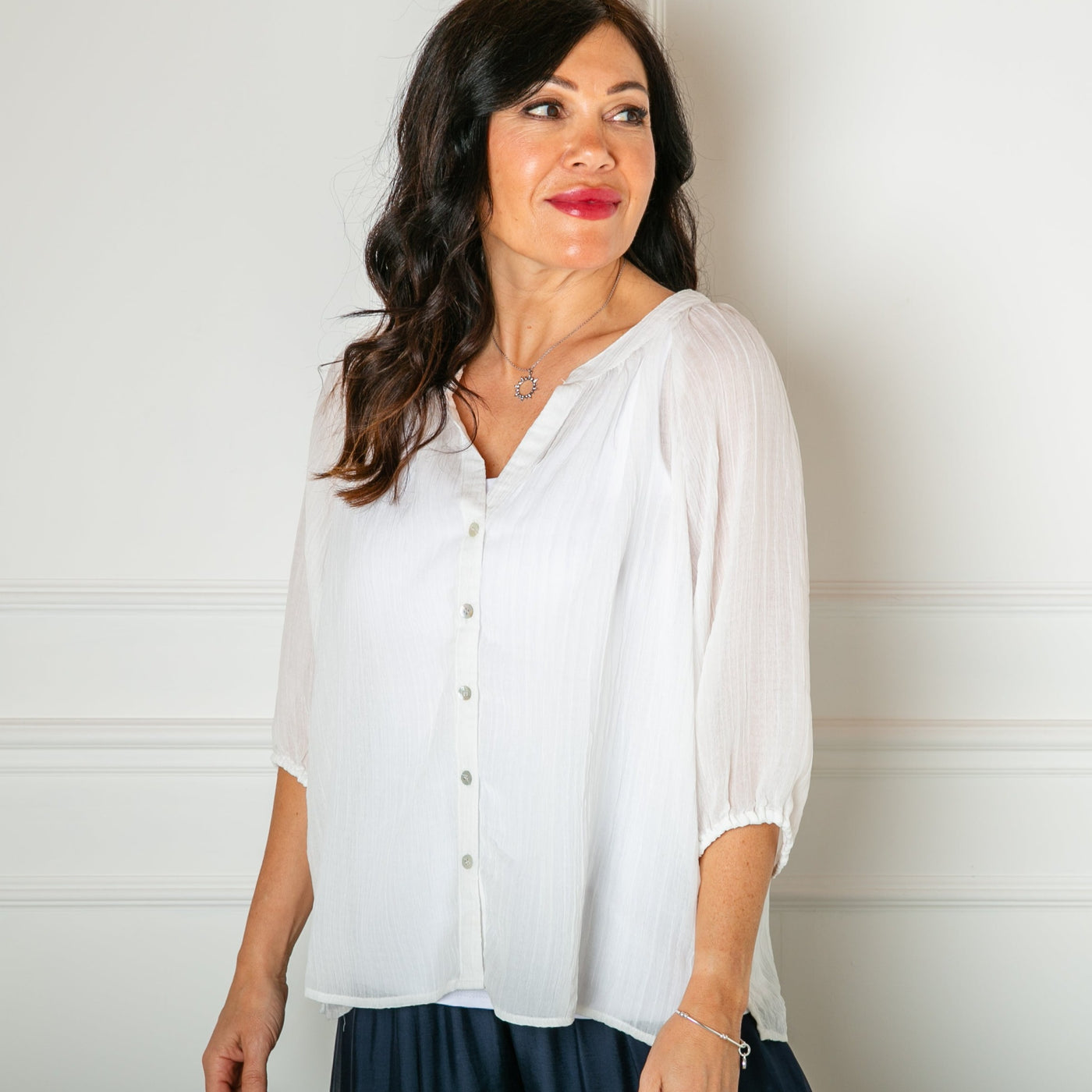 The white Plisse 3/4 Sleeve Blouse with elasticated cuffs for extra comfort