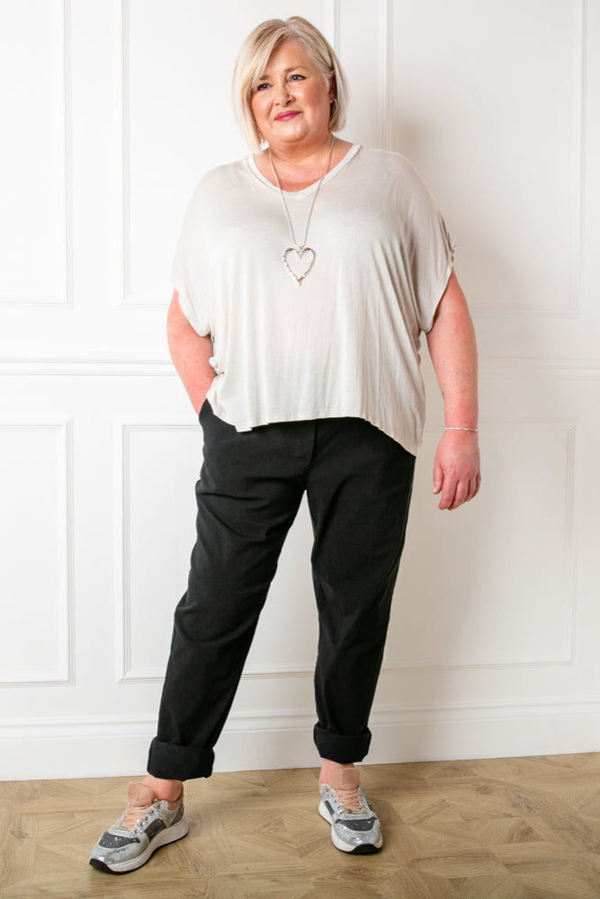 Plus size stretch trousers in black with an elasticated waistband with a drawstring tie detail