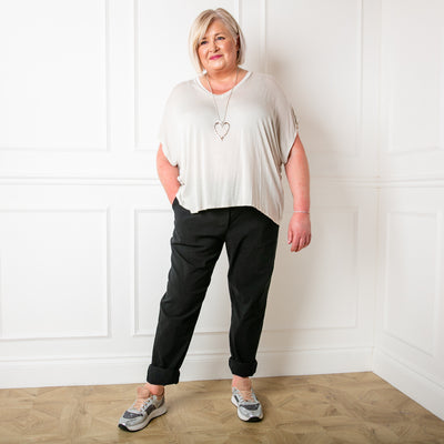 Plus size stretch trousers in black with an elasticated waistband with a drawstring tie detail