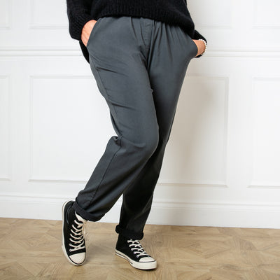 Plus size stretch trousers in charcoal grey with an elasticated waistband with a drawstring tie detail