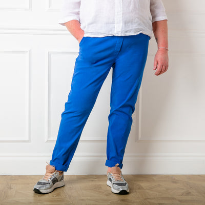Plus size stretch trousers in royal blue with pockets on either side. The bottom hem can be rolled up to any length 