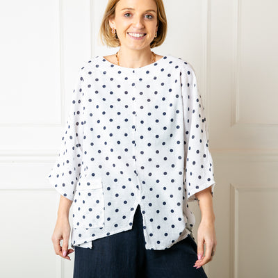 The white and black Polka Dot Linen Blend Top with short sleeves and a round neckline 