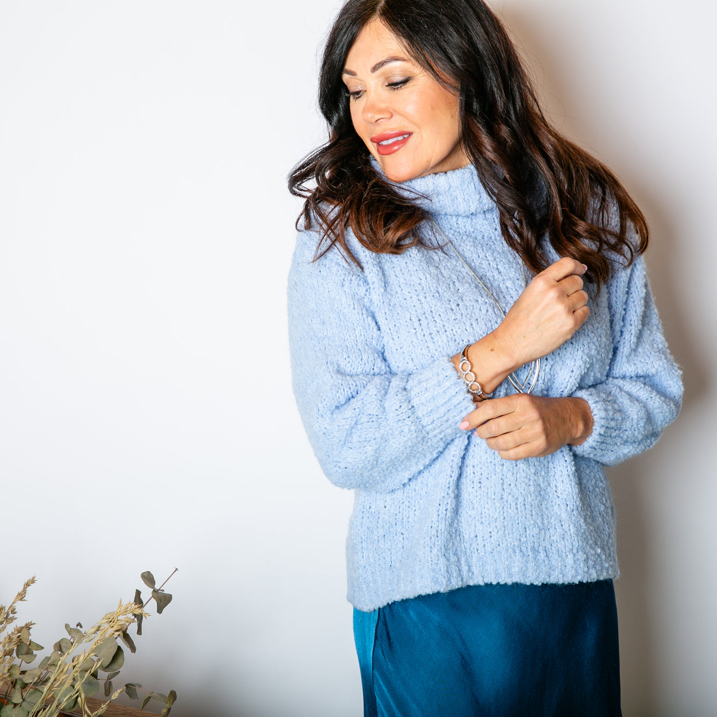 The baby blue Popcorn High Neck Jumper with long sleeves and ribbed cuffs