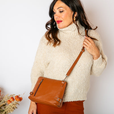 The cream Popcorn High Neck Jumper with a high neck that can be rolled to desired style