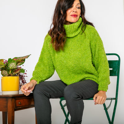 The lime green Popcorn High Neck Jumper with a high neck that can be rolled to desired style