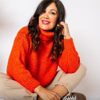 The orange Popcorn High Neck Jumper made from a knitted blend of acrylic, wool and alpaca