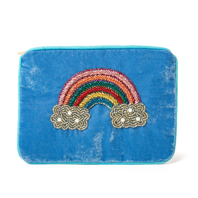 The Pouch in blue over the rainbow cloud embroidery with blue piping trim around the edges