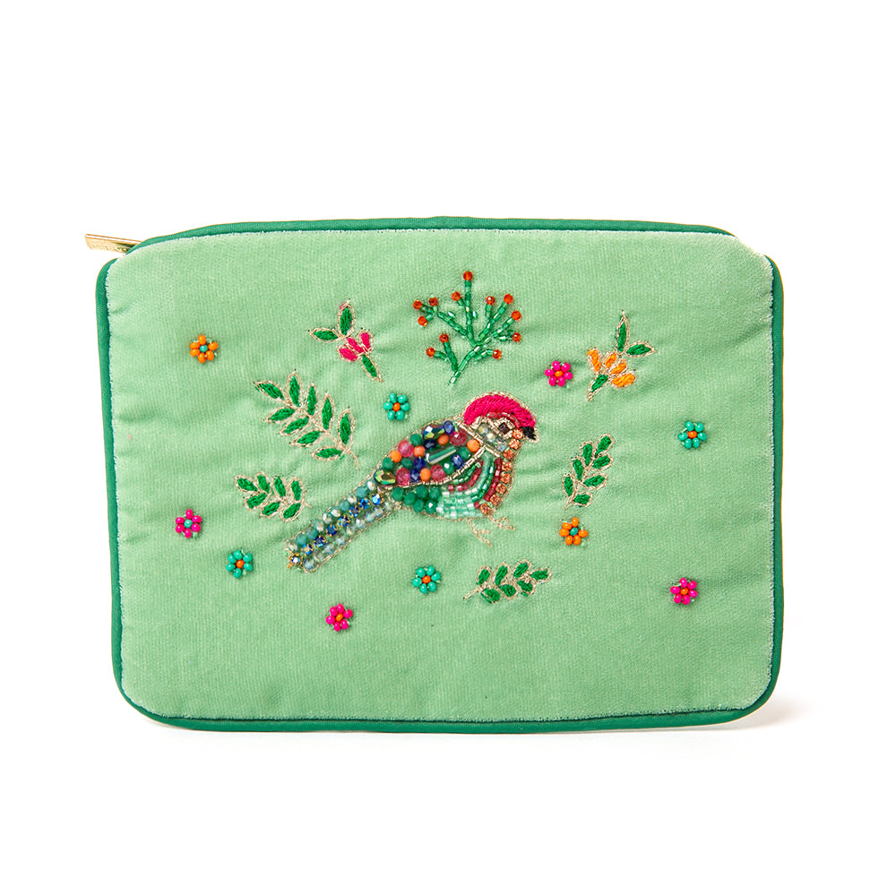 The Pouch in green songbird leaf flower embroidery with green piping trim around the edges