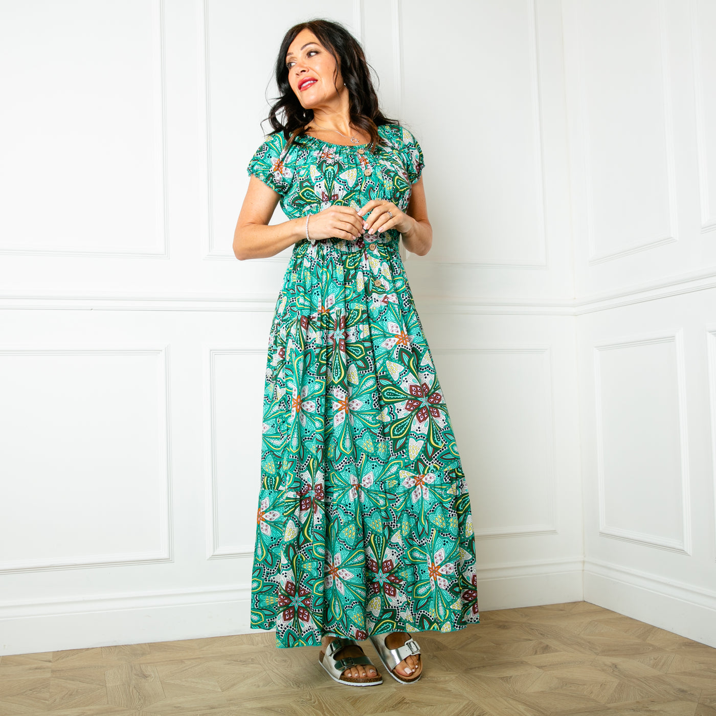 The green Printed Button Maxi Dress with a shirred elasticted waistband and button detailing down the front