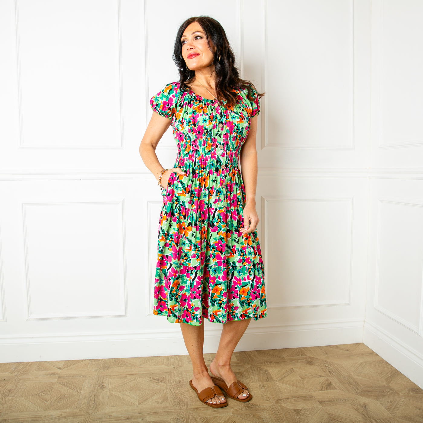 The floral green Printed Button Midi Dress featuring a beautiful colourful flower print, perfect for summer