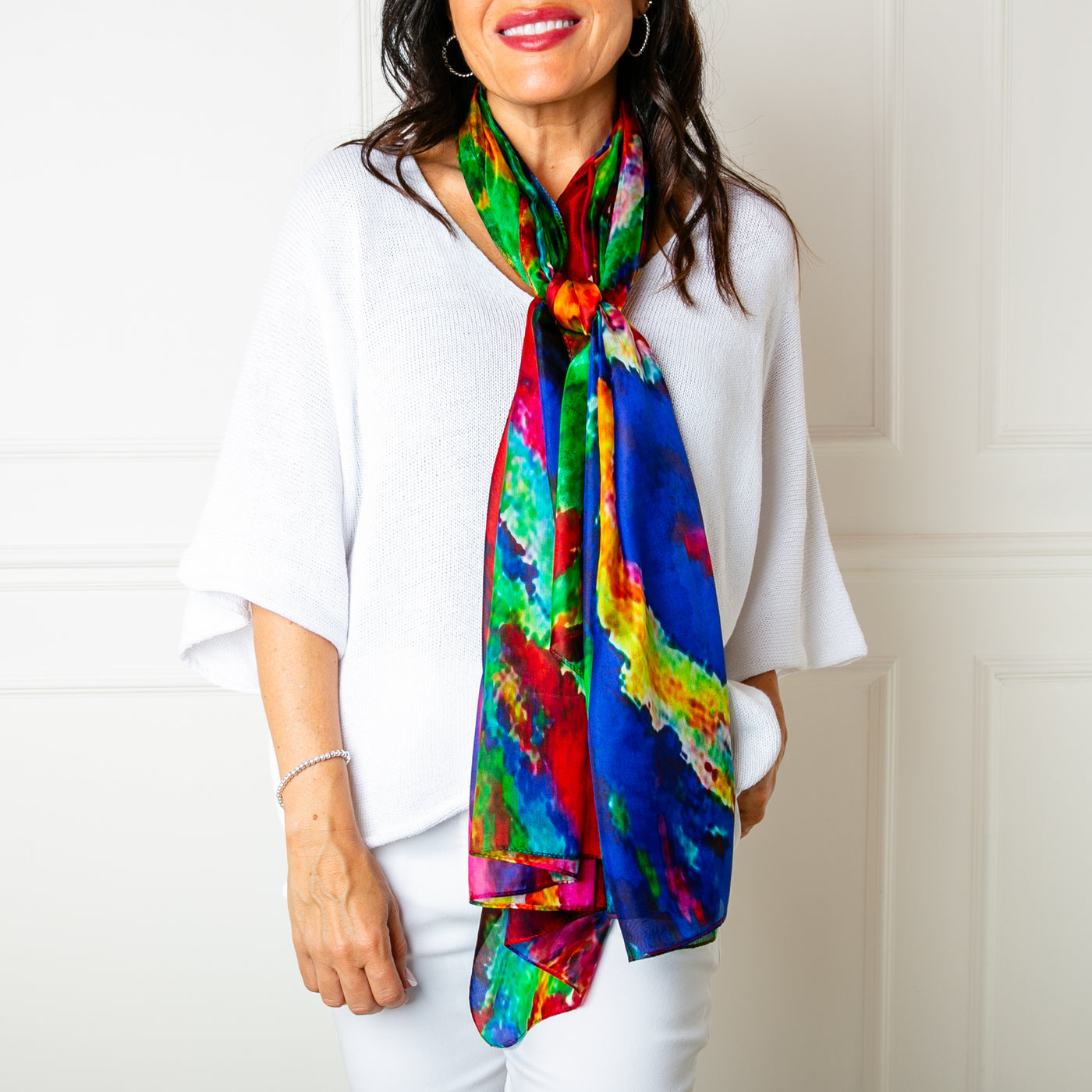 The Rainbow Burst Silk Scarf which can be worn in lots of different ways