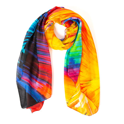 The Rainbow Lights silk scarf which can be worn in so many different ways to make a fashion statement