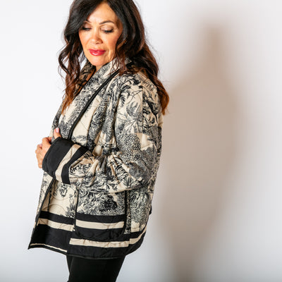 The Black Rainforest Quilted Jacket featuring a gorgeous intricate animal jungle print 