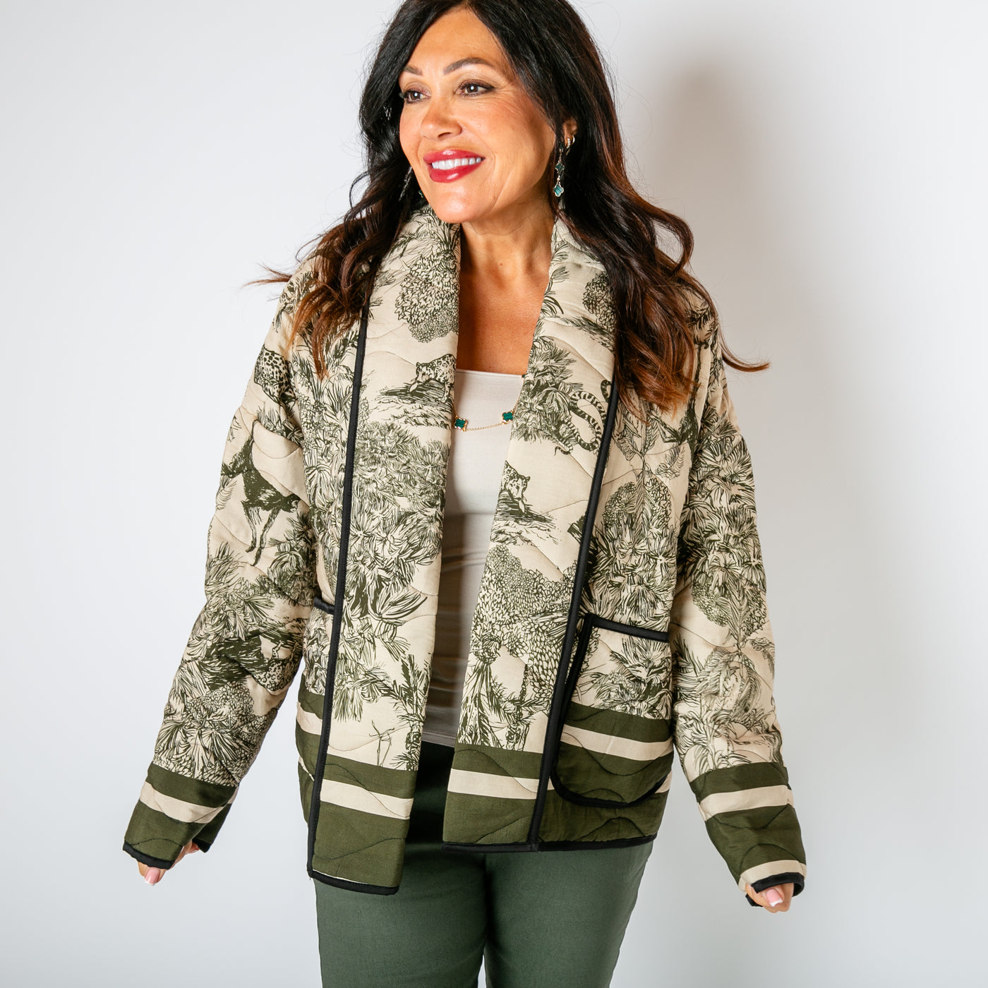 The khaki green Rainforest Quilted Jacket with pockets on either side of the hips