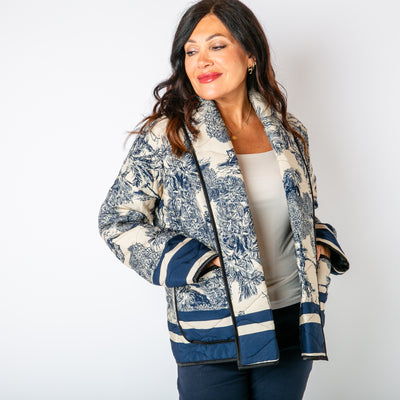 The navy blue Rainforest Quilted Jacket with pockets on either side of the hips