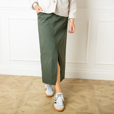 The khaki green Raw Hem Long Midi Skirt for women with side pockets on the front and larger pockets on the back