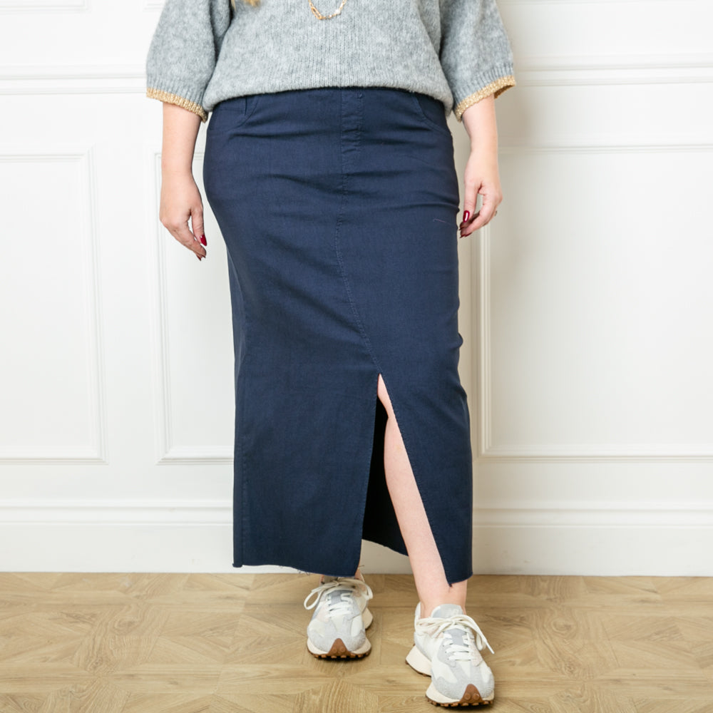 The navy blue Raw Hem Midi Skirt made from a super stretchy fabric made of viscose, nylon and spandex