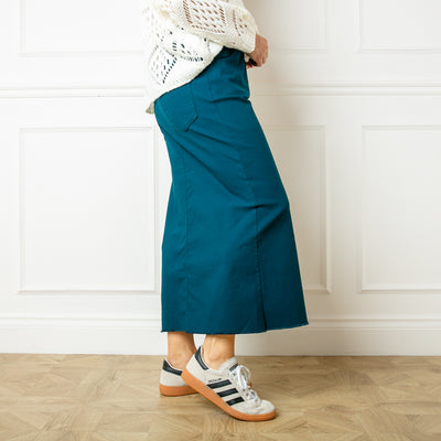 The teal blue Raw Hem Midi Skirt with an elasticated waist and drawstring detailing like our best selling stretch trousers