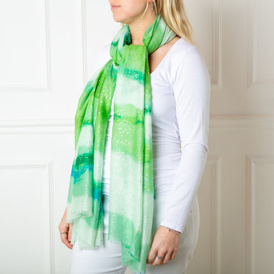 The green Reef Scarf featuring a beautiful gentle watercolour effect striped pattern 