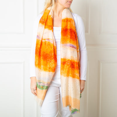 The Orange Reef Scarf featuring a beautiful gentle watercolour effect striped pattern 