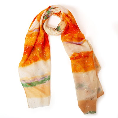 The Reef Scarf in orange made from a super soft lightweight blend of viscose and cotton