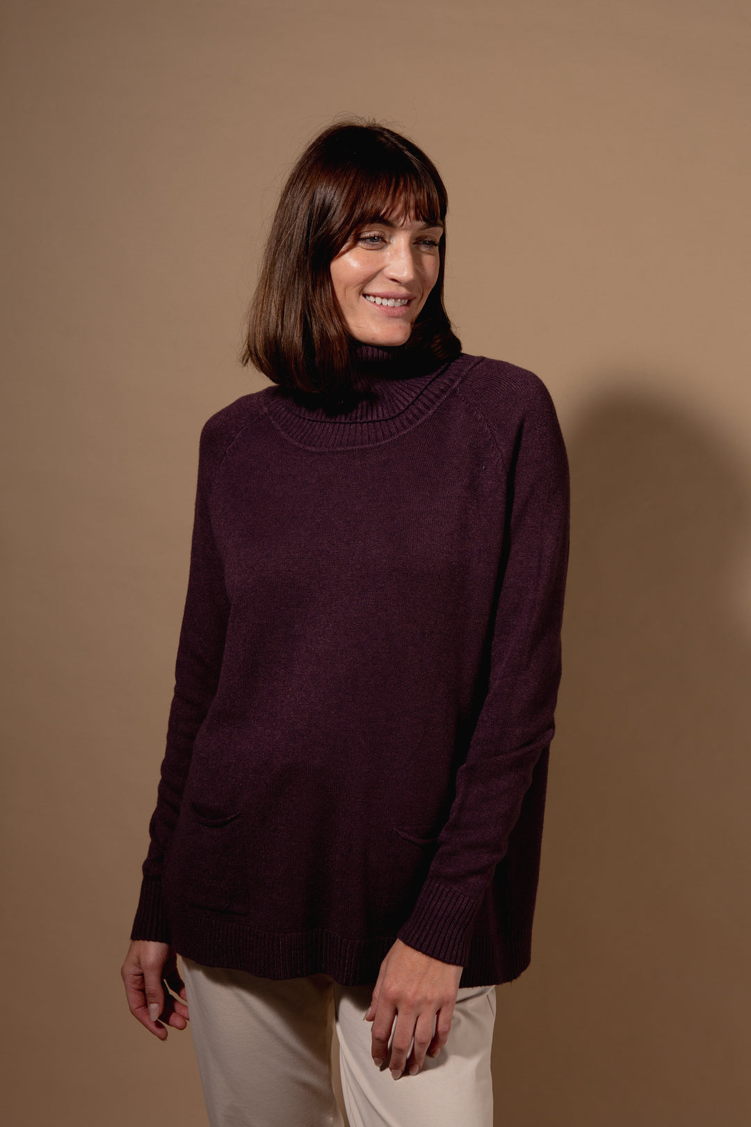 Two Pocket Roll Neck Jumper