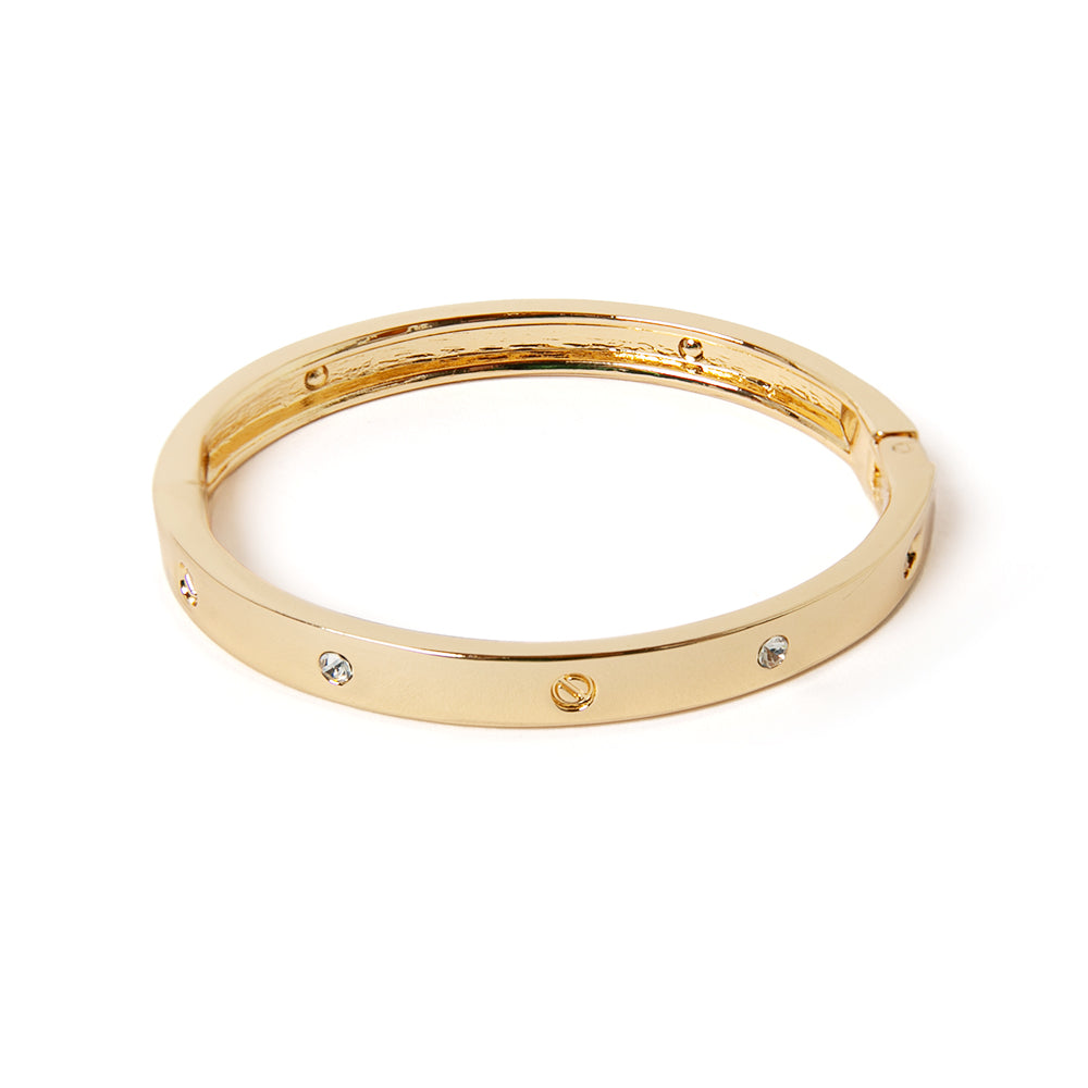 The gold Roxanne Cuff Bracelet with gem stones around the edge for extra sparkle 