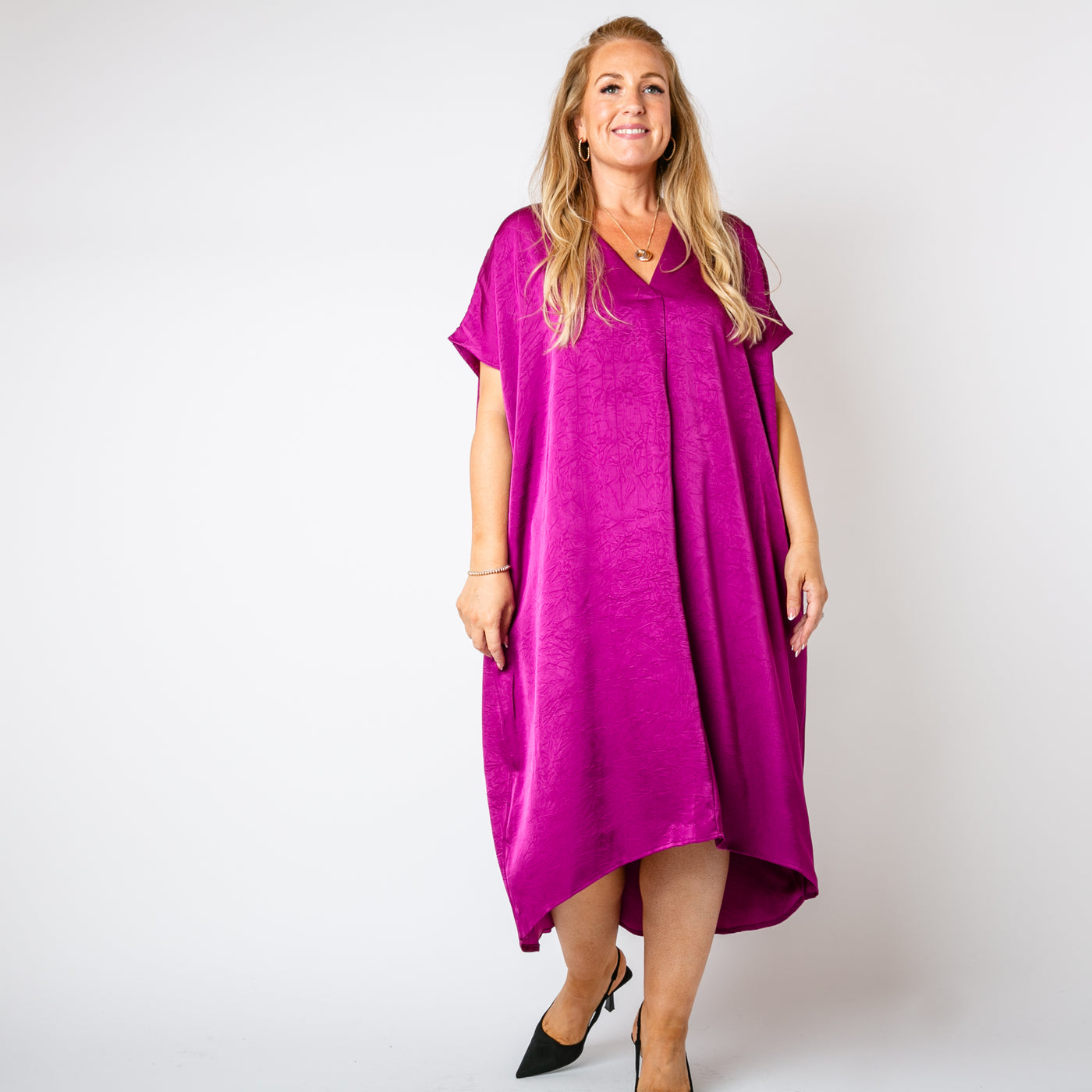 The plum purple Satin Kaftan Dress with pockets on either side of the waist