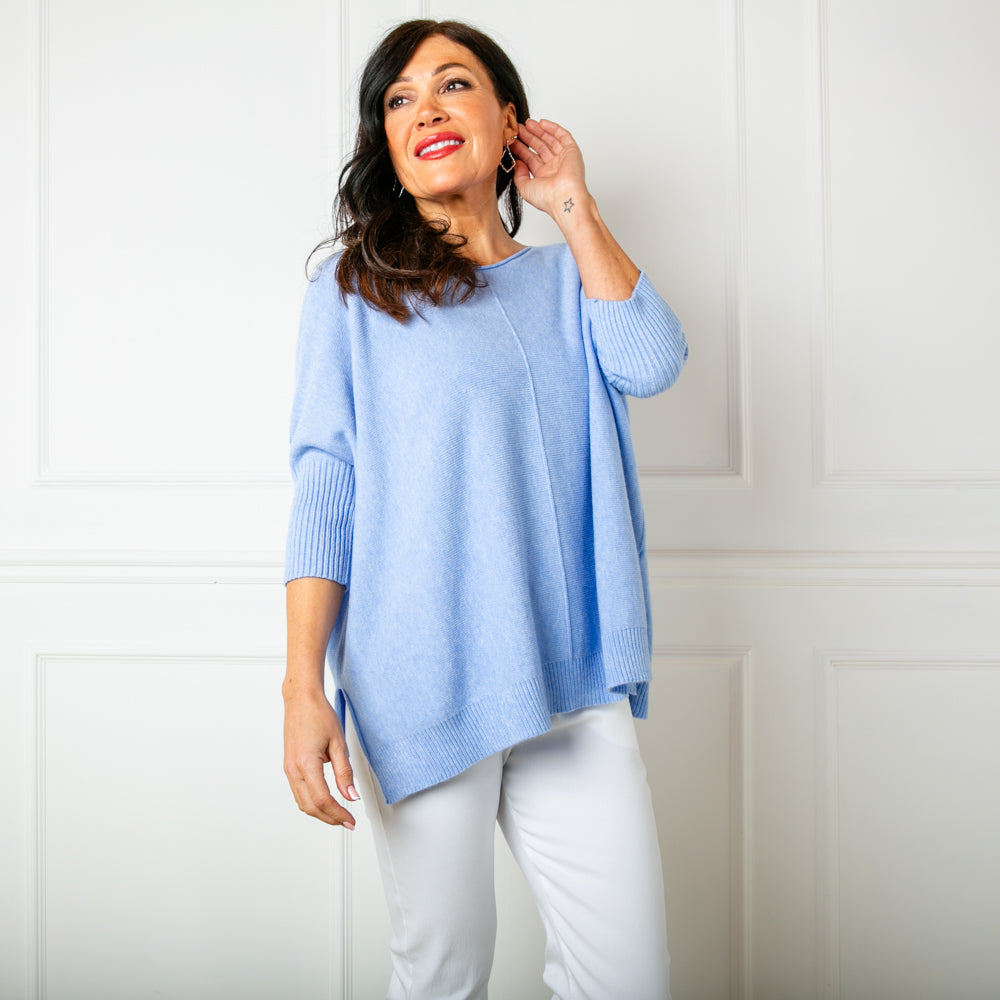 The Baby Blue Seam Front Jumper with a round neckline that has a rolled edge